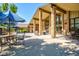Outdoor patio area with comfortable seating and shaded umbrellas, ideal for dining and socializing at 2840 S Heather Gardens Way # A, Aurora, CO 80014