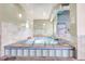 Enjoy this indoor spa with tile surround, a safety rail, and spa rules posted on the wall at 2840 S Heather Gardens Way # A, Aurora, CO 80014