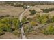 An aerial shot capturing a long driveway leading to a property at 4880 Tall Horse Trl, Sedalia, CO 80135