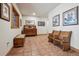 Inviting hallway with terra cotta tile floor, bench seating, and rustic wooden accents at 4880 Tall Horse Trl, Sedalia, CO 80135