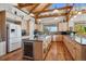 Gourmet kitchen featuring granite countertops, an island with wine storage, and ample cabinet space at 4880 Tall Horse Trl, Sedalia, CO 80135