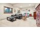 Cozy living room featuring soft carpet, a leather sofa, and a view to the outside at 4880 Tall Horse Trl, Sedalia, CO 80135