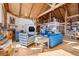 Comfortable living room showcasing vaulted ceilings, hardwood floors, and a cozy fireplace at 4880 Tall Horse Trl, Sedalia, CO 80135