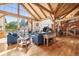 Spacious living room with vaulted ceilings, hardwood floors, a fireplace, and comfortable seating at 4880 Tall Horse Trl, Sedalia, CO 80135