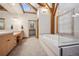 Large bathroom featuring a bathtub, dual vanities, and plenty of natural light at 4880 Tall Horse Trl, Sedalia, CO 80135