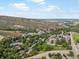 A captivating aerial view showcasing the picturesque neighborhood and scenic mountain backdrop at 109 Bear Creek Ln, Morrison, CO 80465