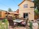 Beautifully landscaped backyard with dining area and outdoor kitchen at 109 Bear Creek Ln, Morrison, CO 80465