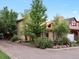 Inviting home exterior showcasing mature landscaping and natural surroundings at 109 Bear Creek Ln, Morrison, CO 80465
