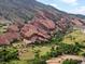 Dramatic rocky mountain landscape featuring majestic rock formations, lush greenery, and walking paths at 109 Bear Creek Ln, Morrison, CO 80465