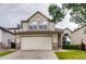 Charming two-story home featuring a neutral color scheme, an attached two-car garage and stone accents at 2792 S Ceylon St, Aurora, CO 80013