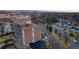 View of a brick apartment building, along with other buildings in the distance, surrounded by city streets at 4800 E Hale Pkwy # 712N, Denver, CO 80220
