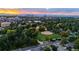 Scenic aerial view of urban park, with baseball diamond and the city skyline at 4800 E Hale Pkwy # 712N, Denver, CO 80220