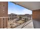Wide balcony view, with some buildings visible on the left and a garden/park in the distance at 4800 E Hale Pkwy # 712N, Denver, CO 80220