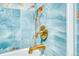 Close-up of bathroom faucet and decorative tile at 4800 E Hale Pkwy # 712N, Denver, CO 80220