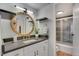 Bathroom with large mirror and updated fixtures plus view of walk-in shower at 4800 E Hale Pkwy # 712N, Denver, CO 80220