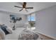 Comfortable bedroom featuring a balcony and a ceiling fan at 4800 E Hale Pkwy # 712N, Denver, CO 80220