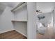 Walk-in closet with wood floors and hanging racks for organized storage at 4800 E Hale Pkwy # 712N, Denver, CO 80220
