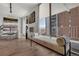 Bright dining area with modern light fixture, hardwood floors, and sliding glass doors to the balcony at 4800 E Hale Pkwy # 712N, Denver, CO 80220