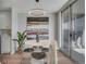 Cozy dining space features hardwood floors, sliding doors to the balcony, and a modern light fixture above the round table at 4800 E Hale Pkwy # 712N, Denver, CO 80220