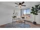 Bright home office with natural light and a contemporary ceiling fan at 4800 E Hale Pkwy # 712N, Denver, CO 80220