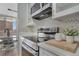 Modern kitchen featuring stainless steel appliances and a sleek black cooktop at 4800 E Hale Pkwy # 712N, Denver, CO 80220