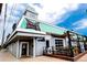 College Inn's exterior showcases a charming bar and dining area with inviting outdoor seating at 4800 E Hale Pkwy # 712N, Denver, CO 80220