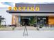Postino restaurant's modern exterior featuring clean lines, greenery, and inviting entrance at 4800 E Hale Pkwy # 712N, Denver, CO 80220