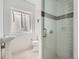 Modern bathroom featuring a glass-enclosed shower with mosaic tile accents, plus a sleek pedestal sink at 2775 California St, Denver, CO 80205