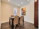 Bright dining room with modern lighting, an elegant table setting, and stylish wicker chairs on wood floors at 2775 California St, Denver, CO 80205