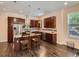 Well-equipped kitchen with dark cabinetry, stainless steel appliances, and hardwood floors at 2775 California St, Denver, CO 80205