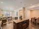 Open-concept layout with a kitchen island flowing into the living room and dining area at 2775 California St, Denver, CO 80205