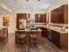 Modern kitchen boasts stainless steel appliances, granite counters, and dark wood cabinetry at 2775 California St, Denver, CO 80205