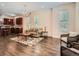 Open-concept living area with hardwood floors connecting the kitchen and living spaces at 2775 California St, Denver, CO 80205