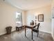 Bright office space featuring a desk, chair, carpet floors, and ample light from a window at 2775 California St, Denver, CO 80205