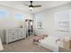 Bedroom with a dresser, shelving, and a large window at 1039 Highview Dr, Erie, CO 80516