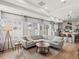Open-concept living room flowing into the kitchen, complete with modern furnishings and hardwood floors at 1039 Highview Dr, Erie, CO 80516