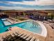 Community pool area featuring pools, a splash zone, and lounge chairs, surrounded by landscaping at 1039 Highview Dr, Erie, CO 80516