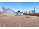 Low-maintenance backyard featuring gravel, a fire pit, and privacy fencing at 4455 Brentwood St, Wheat Ridge, CO 80033