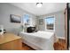 Cozy bedroom with two windows, hardwood floors, and stylish decor at 4455 Brentwood St, Wheat Ridge, CO 80033