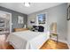 Comfortable bedroom featuring lots of natural light, hardwood floors, and tasteful decor at 4455 Brentwood St, Wheat Ridge, CO 80033