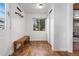 Practical entryway featuring ceramic tile, coat hooks, and a bench at 4455 Brentwood St, Wheat Ridge, CO 80033