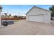 Spacious garage with an expansive concrete driveway and outdoor lighting for evening enjoyment at 4455 Brentwood St, Wheat Ridge, CO 80033