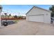 Spacious garage with an expansive concrete driveway and outdoor lighting for evening enjoyment at 4455 Brentwood St, Wheat Ridge, CO 80033