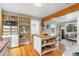 Kitchen island featuring a wood countertop and open shelving at 4455 Brentwood St, Wheat Ridge, CO 80033