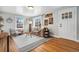 Cozy living room with large windows and beautiful hardwood floors at 4455 Brentwood St, Wheat Ridge, CO 80033