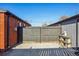 View of a backyard with a wooden fence and a concrete patio at 3324 N Glencoe St, Denver, CO 80207