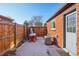 Private backyard with patio and wood fence at 3324 N Glencoe St, Denver, CO 80207