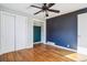 Bright bedroom featuring hardwood floors and neutral walls at 3324 N Glencoe St, Denver, CO 80207