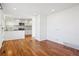 Dining area with hardwood floors and open kitchen view at 3324 N Glencoe St, Denver, CO 80207