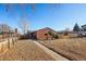 Brick ranch home with a walkway leading to the front entrance and a well-manicured lawn at 3324 N Glencoe St, Denver, CO 80207